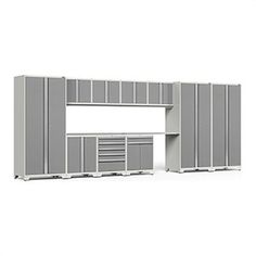 a large gray cabinet sitting next to a white wall with drawers and cabinets on it