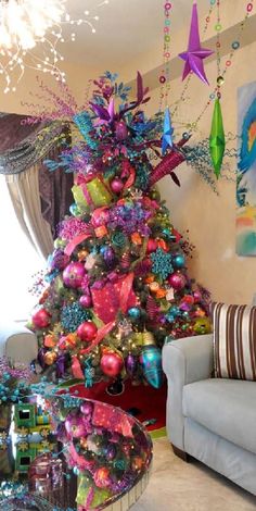 a brightly colored christmas tree in a living room