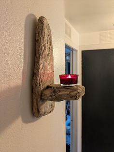 a candle that is sitting on a shelf