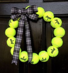 a tennis ball wreath is hanging on a door with the words, i do not want to