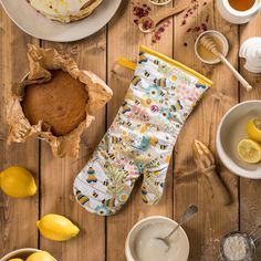 a table with lemons, cake and tea on it