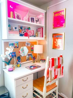 a white desk topped with a wooden chair next to a book shelf