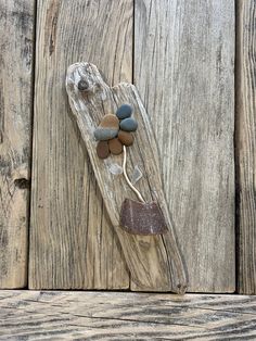 a piece of wood with rocks on it