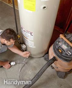 a man is working on a water heater