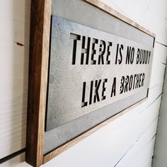 there is no buddy like a brother sign on the wall