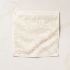 a white towel folded on top of a table