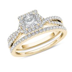 a yellow gold engagement ring set with a princess cut diamond in the center and two rows of diamonds on each band