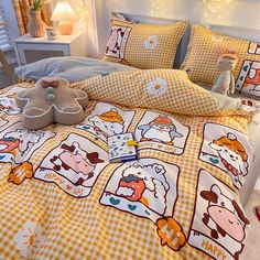 a bed covered in yellow and white checkered sheets with cartoon characters on the covers