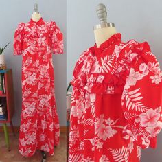 "Pretty Hawaiian dress from the 80's era! Red and white graphic hibiscus flower and leaf print. Ruffle edged high button neck with ruffle trimmed puffed shoulders, sleeves, chest, shoulders and bottom ruffle. Buttons up from the waist. Short elastic sleeves and full slightly flared skirt. Left hip pocket. Ankle length. Neck can be worn buttoned up or open. Stylish and flattering for any figure! Fits like a size medium through the shoulders. Please check the measurements below: MEASUREMENTS--Take Hawaiian Maxi Dress, Elastic Sleeves, Hibiscus Flower, Spring Dress, Flared Skirt, Leaf Print, Dress Summer, Flare Skirt