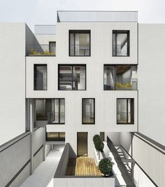 an apartment building with multiple balconies and windows