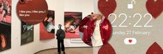 a man standing in front of a wall with posters on it that say i love you