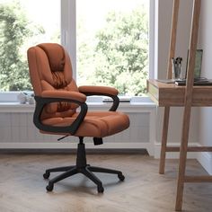 an office chair sitting in front of a window