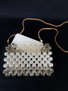 Chic Pearl Embellished Shoulder Bag For Party, Glamorous Pouch Shoulder Bag For Gift, Glamorous Pouch Shoulder Bag As Gift, Glamorous Gift Pouch Shoulder Bag, Chic Beaded Shoulder Bag For Party, Beaded Clutch Shoulder Bag As Gift, Handheld Beaded Shoulder Bag For Party, Handheld Bags With Pearl Embroidery For Party, Elegant Beaded Shoulder Bag For Gift