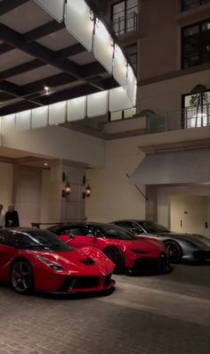 a group of cars parked inside of a building