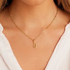 Description Personalize your favorite chain necklace with this playful helium alphabet charm. Wear your initials or a loved one's - you can make a set here. Product Details Total drop 11/16" Letter measures 5/16" by 3/8" Hinge closure measures 3/16" by 5/16" Available in 18k gold plated brass Avoid contact with anything containing derivatives of alcohol Dainty Everyday Initial Pendant Charms, Dainty Everyday Charms With Initial Pendant, Classic Gold Plated Initial Pendant Necklace, Classic Gold Charm Necklaces With Initials, Classic Initial Pendant Necklace With Charms, Classic Gold Monogram Charm Necklace, Classic Gold Charm Necklace With Monogram, Everyday Initial Pendant Name Necklace, Hypoallergenic Initial Pendant Charm Necklace