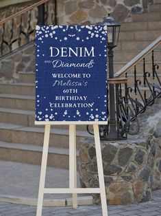 a welcome sign is displayed in front of some steps and railings, with the words denim on it