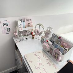 a white desk topped with lots of personal items