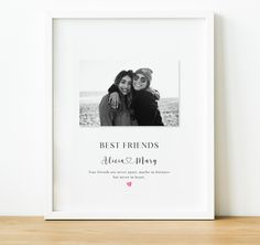 two women are hugging each other in front of a white frame with the words best friends above them