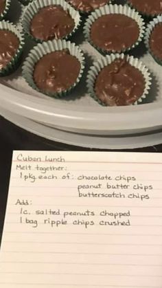 chocolate cups are lined up on a plate with paper next to it and a recipe for the cupcakes