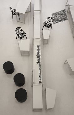 an architectural model is shown with black and white furniture