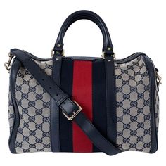 100% authentic Gucci Vinatge Boston bag in navy blue and ivory GG canvas with blue leather trim and classic red & blue Web stripe in the middle. The design features light gold-toned hardware and opens with a zipper on top. Lined in ivory canvas including one zip pocket and two smartphone pockets.Has been carried and shows one darker spot on the lining. Two extra holes got added tot the shoulder-strap. Overall in excellent condition. Comes with dust bag. Measurements Height 21cm (8.2in) Width 32c Gucci Shoulder Bag With Leather Trim And Double Handle, Gucci Shoulder Bag With Double Handle And Leather Trim, Luxury Navy Bags With Gold-tone Hardware, Gucci Satchel With Leather Handles, Gucci Coated Canvas Satchel For Travel, Gucci Tote Bag With Leather Trim, Gucci Designer Satchel With Leather Handles, Gucci Luxury Satchel With Leather Handles, Designer Gucci Satchel With Leather Handles