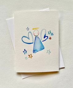 a card with an angel design on it