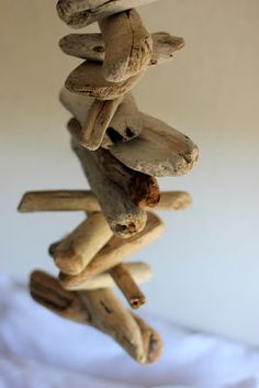 a group of mushrooms stacked on top of each other in front of a white wall