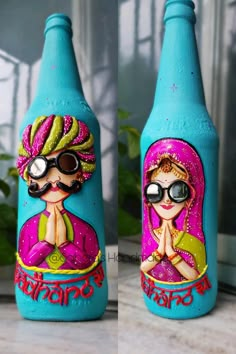 two blue bottles decorated with images of women and men on them, one is wearing sunglasses