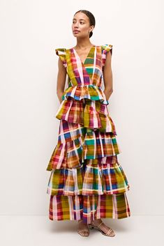 Headed to a wedding this summer? Marisol is your girl. Marie Oliver’s take on black-tie, this romantic, figure-flattering silhouette features a surplice neckline, flutter sleeves, cascading tiers of asymmetric ruffles, and ties at the back that can be looped into a bow. An electric-hued Madras plaid adds an extra dose of drama to this statement-making dress. -Invisible zipper side closure-Ruffle skirt-Front and back v-neck opening with back tie closure-100% cotton -Fully lined-True to size-Care Madras Dress, Girlie Clothes, Draped Bodice, African Designs, House Dresses, Madras Plaid, Surplice Neckline, Ruffle Skirt, Flutter Sleeves