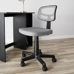 an office chair sitting in front of a desk