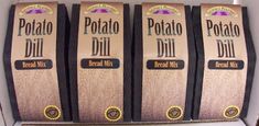 three packages of potato dill bread mix sitting in a cardboard box next to each other