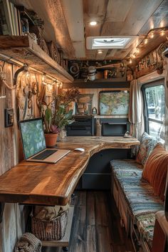 the interior of an rv is decorated in rustic wood and features a desk, couch, and computer