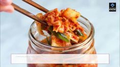 a person holding chopsticks in a jar full of food with the caption below it