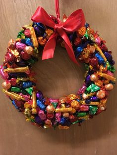 a candy wreath hanging on the wall