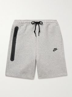 Nike's shorts are made from the same cotton-blend Tech Fleece as its popular sweatpants, so if you're a fan, you know they'll stand up to plenty of wear. They're topped with an adjustable drawstring waistband and feature the signature taped pocket. Nike Tech Shorts, Nike Collection, Ralph Lauren Blazer, White Shoes Sneakers, Luxury Sneakers, Shorts For Men, Nike Tech, Tech Fleece, Casual Blazer