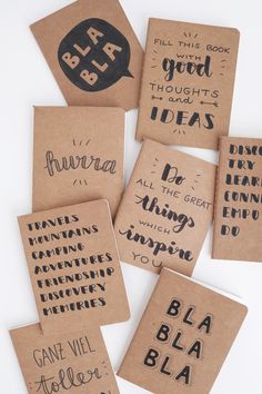 six handmade notebooks with black ink on them