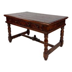 an old wooden table with carvings on the top