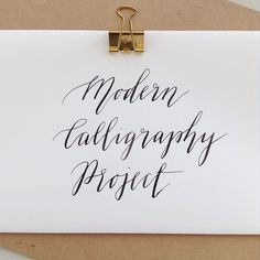 a piece of paper with the words modern calligraphy project written on it