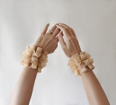 Renaissance beige tulle ruffle cuffs bracelets for bride or themed photoshoots, wedding handmade arm ruffs gloves entirely made by Elyseeart. Unique hand-sewn adjustable cuffs set.  If you are the kind of person that loves unique artistic jewelry that really stands out, then consider browsing my shop to find the original piece for you.  ♥ Materials: hand sewn layered tulle, the tulle is very soft and comfy to wear on skin. They're adjustable with tulle ribbons, universal size, you can adjust the Tutu En Tulle, Cuffs Bracelets, Costume Wedding, Bridal Cuff, Arm Cuffs, Handmade Boutique, Tulle Tutu, Arm Cuff, Etsy Sales