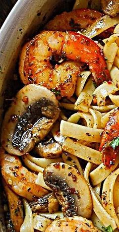 pasta with shrimp and mushrooms in a pan