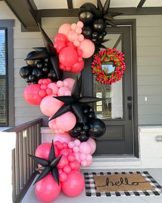 a bunch of balloons are on the front porch