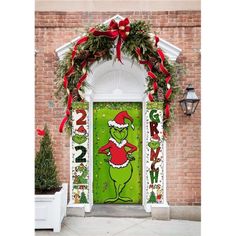 the grin door is decorated with christmas decorations