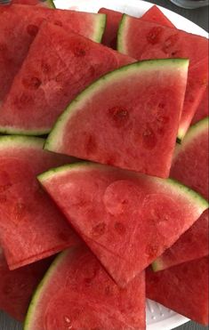 slices of watermelon on a white plate