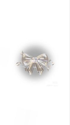 an image of a white bow brooch on a white backgrounge background