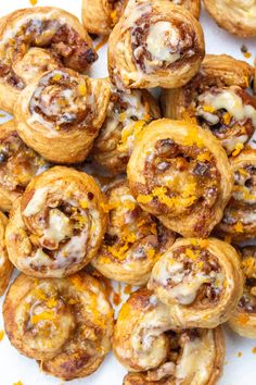 a pile of pastries sitting on top of a white plate