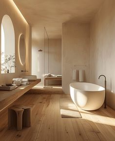 a bath room with a large tub and a sink inside of it on a hard wood floor