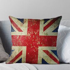 an old and worn british flag throw pillow