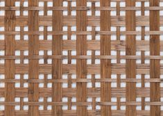 a close up view of the weave pattern on a wooden surface, with white squares