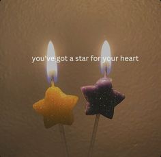 two small candles with the words you've got a star for your heart