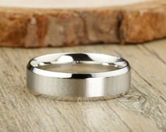 a wedding ring sitting on top of a wooden table